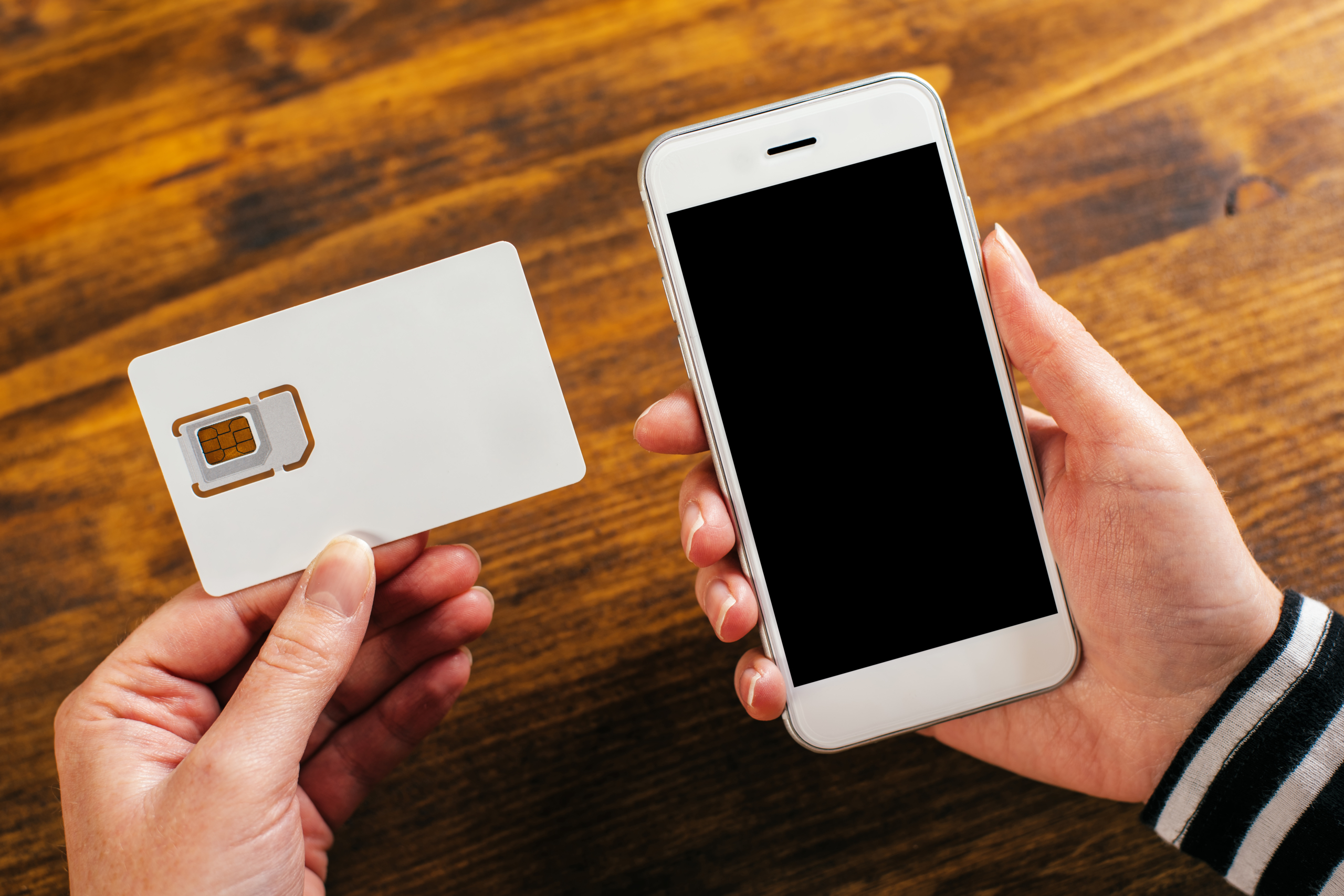 Woman holding smartphone and new SIM card, mock up image