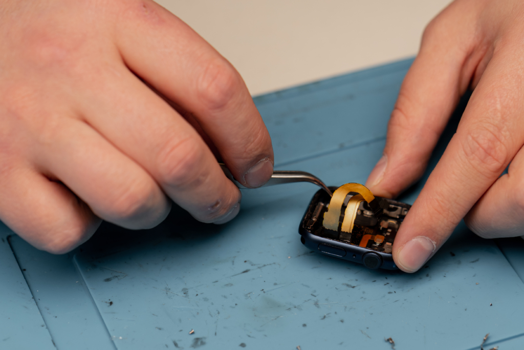 Macro shot - smart watch being repaired by an engineer